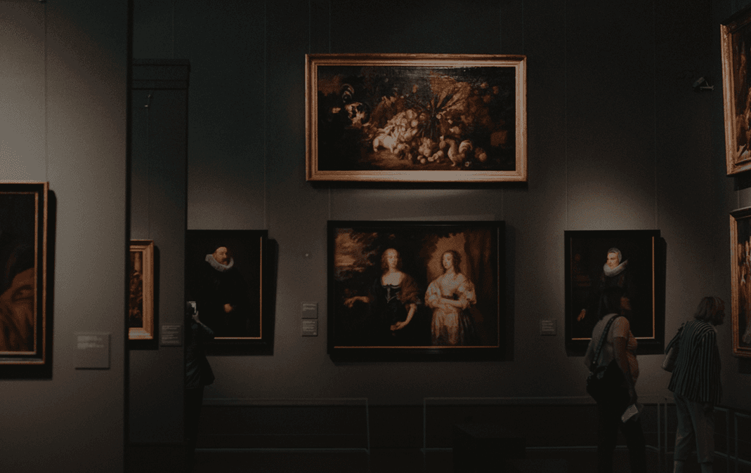 Museum gallery interior with framed paintings