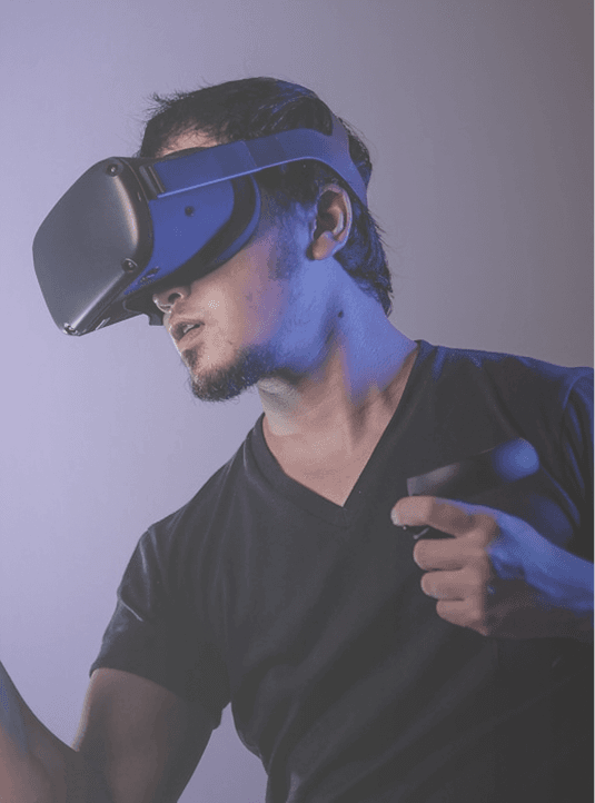 Person wearing a VR headset and holding controllers
