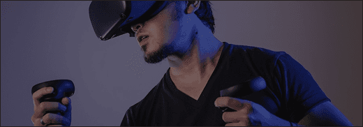 Person wearing a VR headset and holding controllers